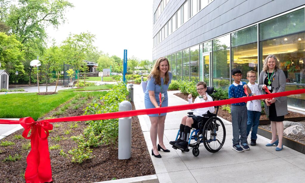 Some people in a ribbon cutting ceremony